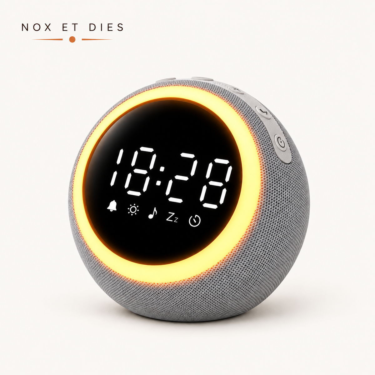 Réveil veilleuse Nox et Dies en tissu gris, vue de face rapprochée mettant en valeur les boutons latéraux et le cercle lumineux.